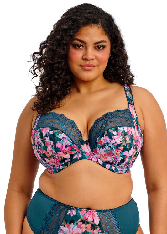 curvy woman wearing a big cup bra with flower pattern and lace in teal color