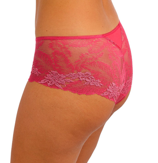 woman wearing a geranium pink short with embroidered soft pink flowers