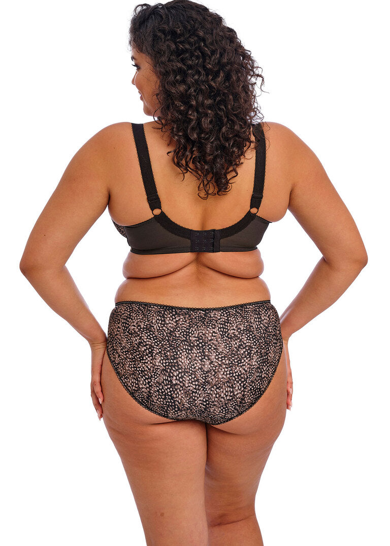 curvy woman wearing a big cup bra in ebony brown with subtile leaves print in soft pink and brown stretch lace