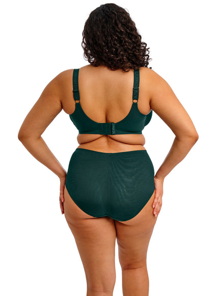 curvy woman wearing a deep emerald satin bra with lace details and matching brief