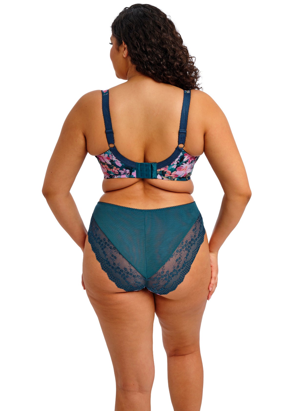 curvy woman wearing a big cup bra with flower pattern and lace in teal color