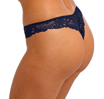 woman wearing a tanga in  blue lace wit little strass details