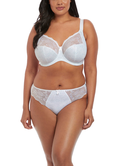 curvy woman wearing a big cup bra in white with subtile leaves print and stretch lace 