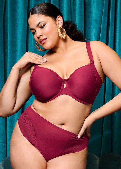 curvy woman wearing a red plussize high leg high waist brief with matching bra