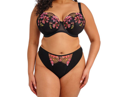 curvy woman wearing a black thong with lace and embroidered flowers in summer colours