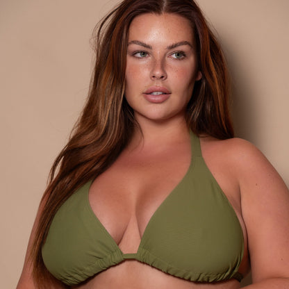 plussize woman wearing a khaki green triangle bikini  against a beige background