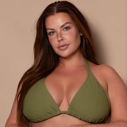 plussize woman wearing a khaki green triangle bikini  against a beige background