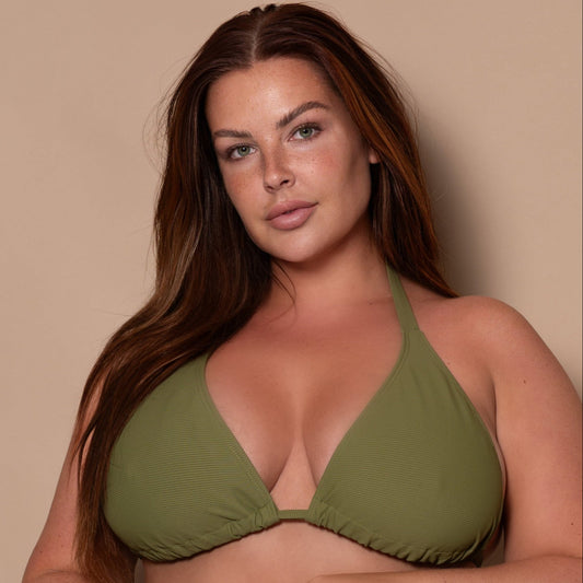 plussize woman wearing a khaki green triangle bikini  against a beige background
