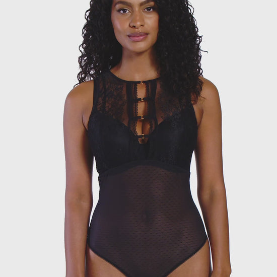 woman wearing a black bodysuit with mesh and lace