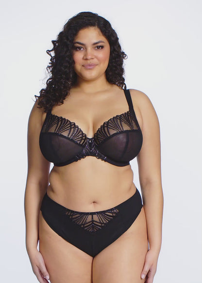 Black lingerie set with lace detailing on a white background