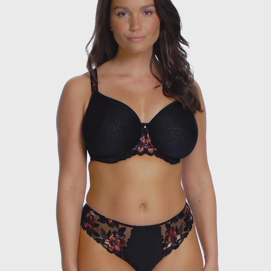 woman wearing a black spacer bra with embroidered floral details in sunset colors